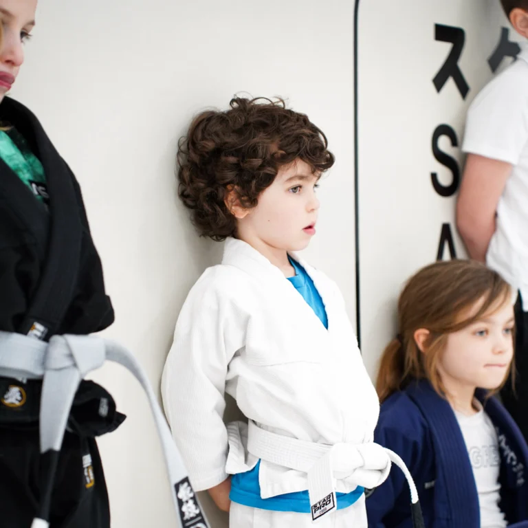 Children listening during a Brazilian Jiu-Jitsu class at Leeds